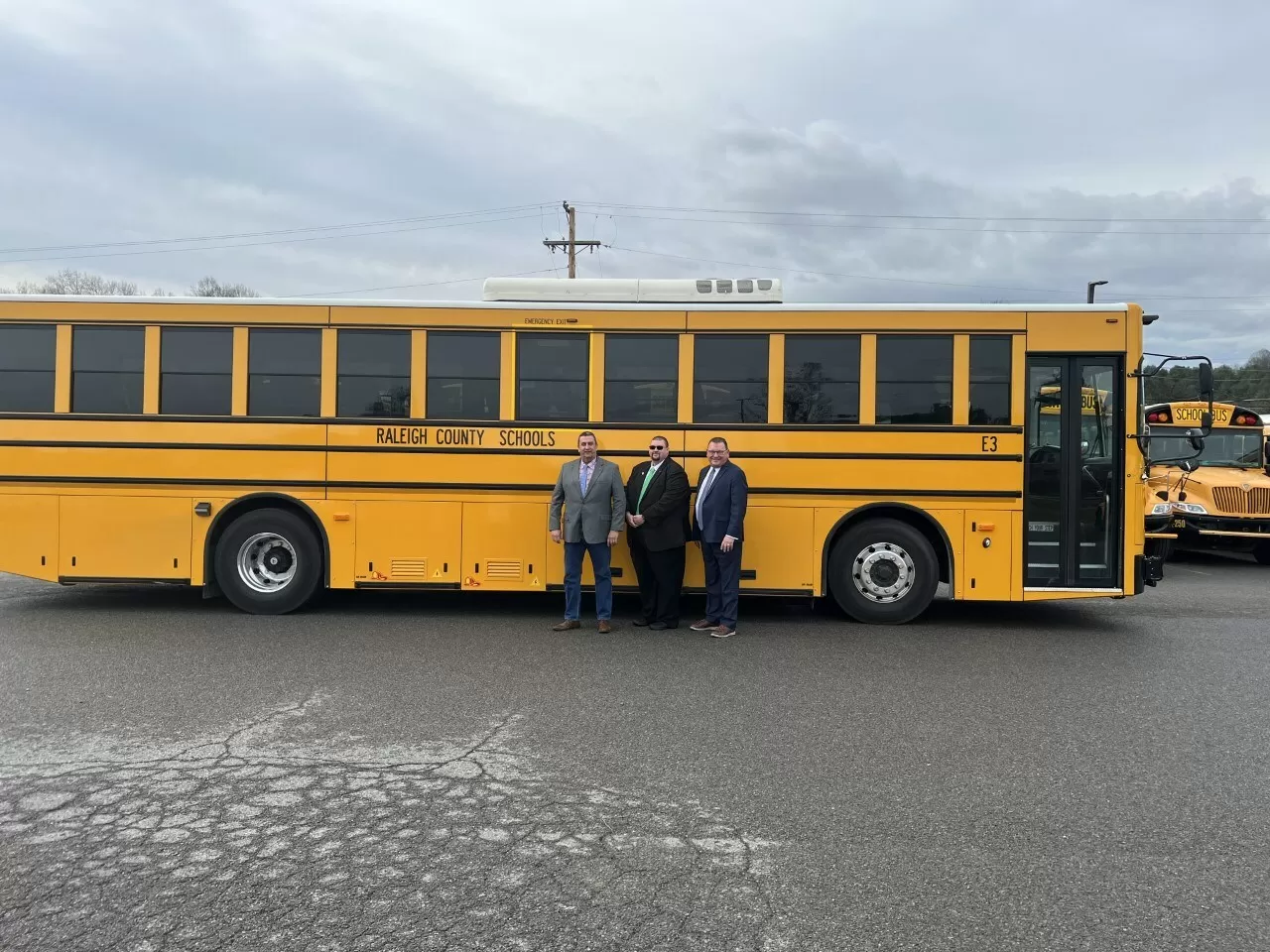 Raleigh County Schools Director of Transportation Gary Daniel takes delivery of a GreenPower all-electric BEAST school bus. Joining him are West Virginia Delegate Chris Toney and GreenPower Vice President Mark Nestlen. img#3