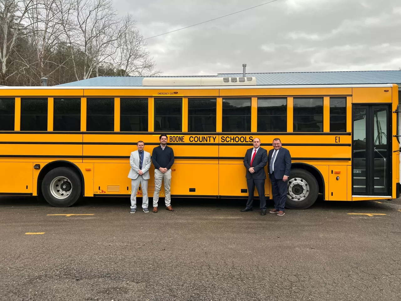 Tony Tagliente, Assistant Superintendent; Brian Linville, Director of Transportation; Superintendent Matt Riggs and GreenPower’s Vice President Mark Nestlen as GreenPower’s Type D all-electric BEAST is delivered img#2