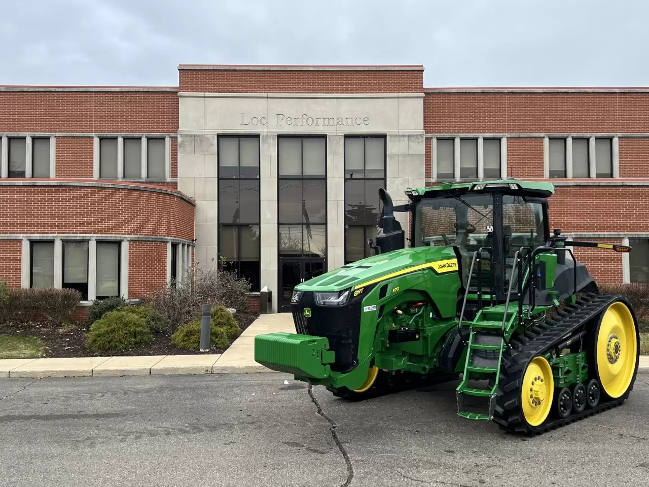 John Deere 8RT tractor outside the Loc Performance headquarters in Plymouth, Mich. Loc supplies fully molded rubber tracks for the John Deere 8RT. img#1