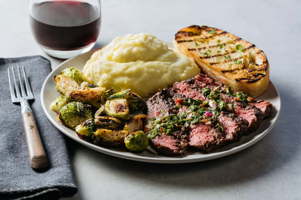 Urban Plates' grilled grass-fed steak with organic mashed potatoes, roasted Brussel sprouts, and grilled rustic bread img#1