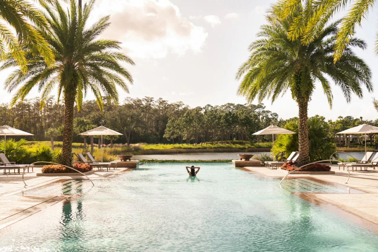 Relax beneath the palms at the infinity-edge Oasis pool, the only adult pool within Walt Disney World Resort. img#1