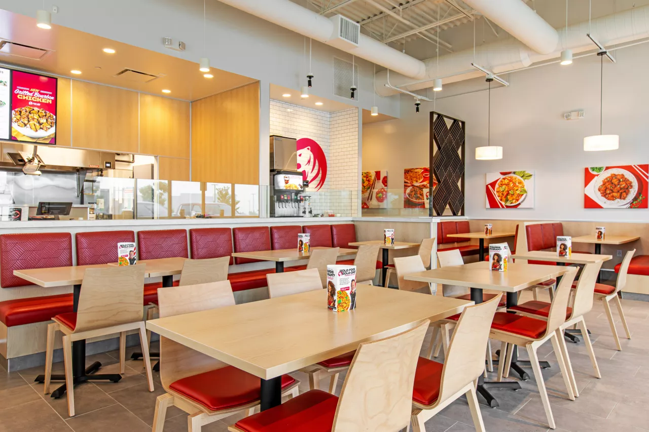 Pei Wei Mansfield dining room. Pei Wei Asian Kitchen recently introduced this clean, bright look utilizing light wood and granite finishes throughout the dining room, which contrasts beautifully with their bold, signature red colors and craveable food photography. img#1