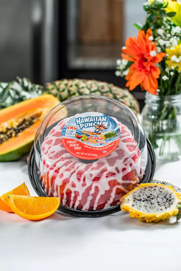 Cafe Valley launches its 16-ounce Hawaiian Punch® Fruit Punch Ring Cake featuring tropical flavors like orange, pineapple, passionfruit, guava, and papaya and is topped with coarse sugar. img#1