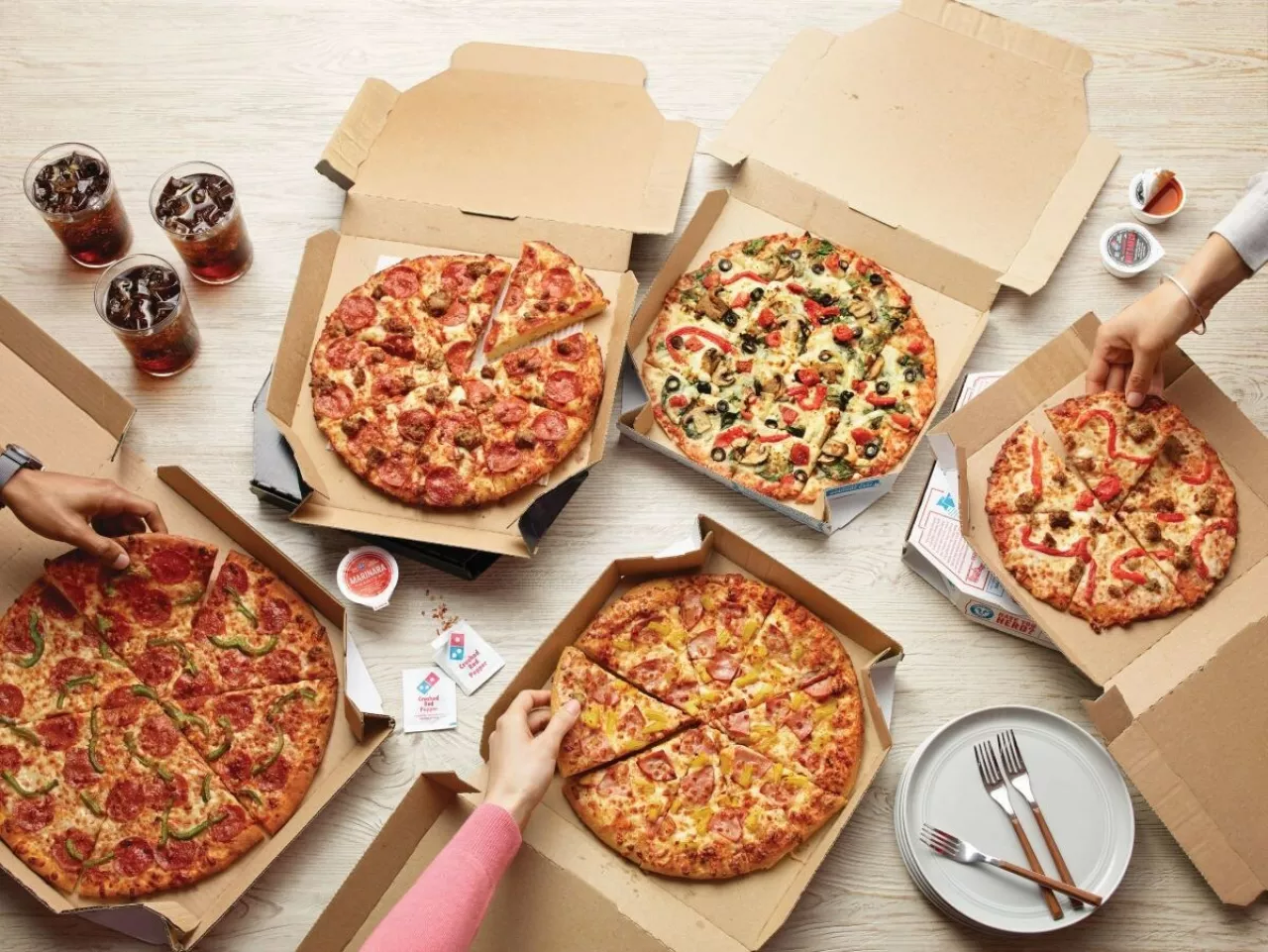 Domino's is celebrating college basketball’s biggest month by offering customers 50% off all menu-priced pizzas ordered online from March 20-26. img#1