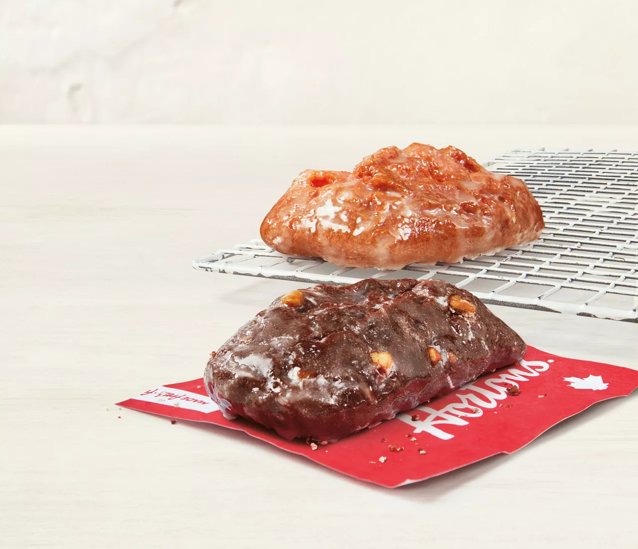 Tim Hortons is bringing back the beloved Walnut Crunch and Cherry Stick donuts for a limited time to celebrate National Donut Day!