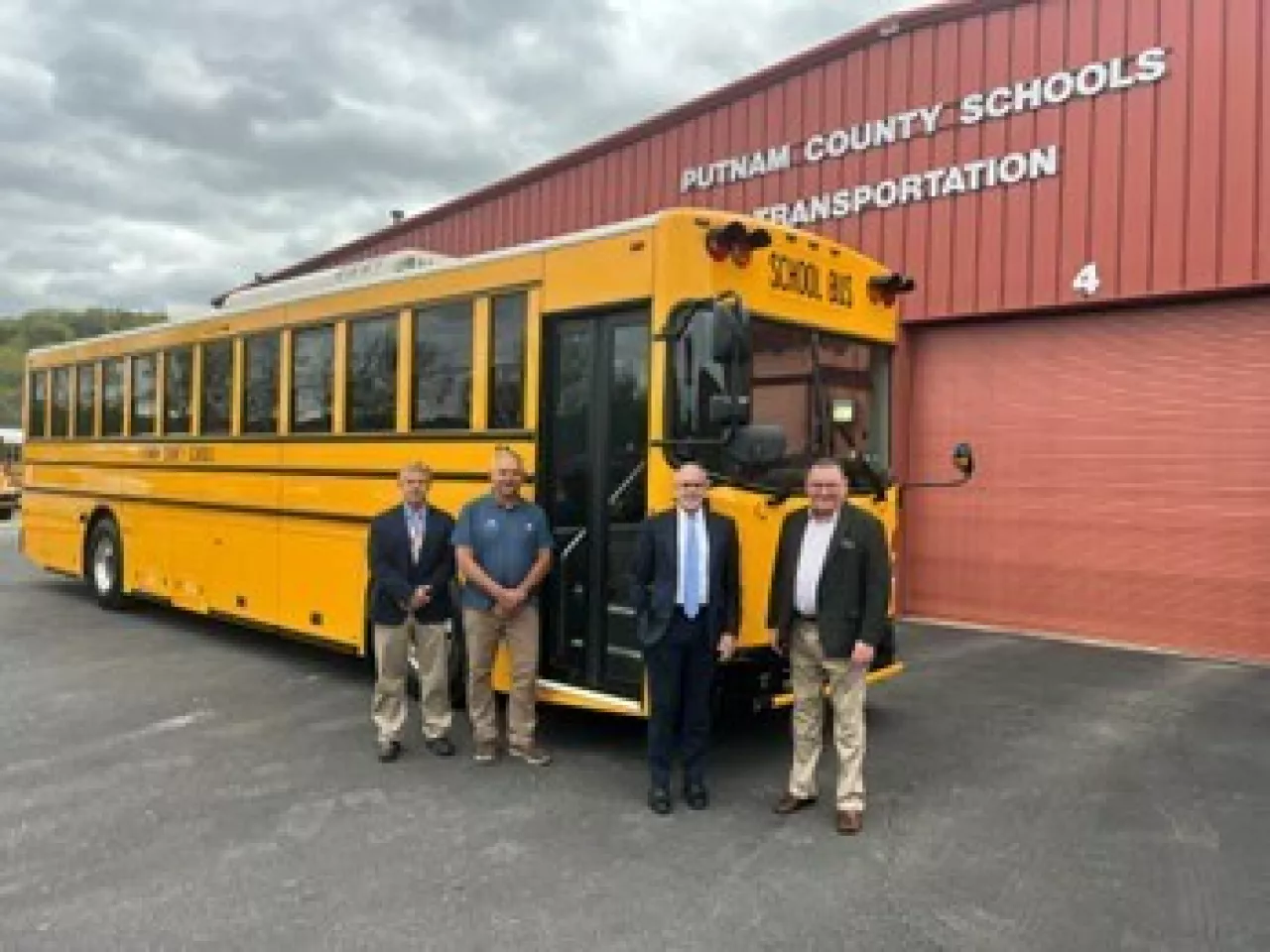 Putnam County Schools taking delivery of a GreenPower BEAST all-electric purpose-built school bus. In the photo are Bruce McGrew, Assistant Superintendent; Pat Clark, Director of Transportation; John Hudson, Superintendent and GreenPower Motor Vice President Mark Nestlen img#2