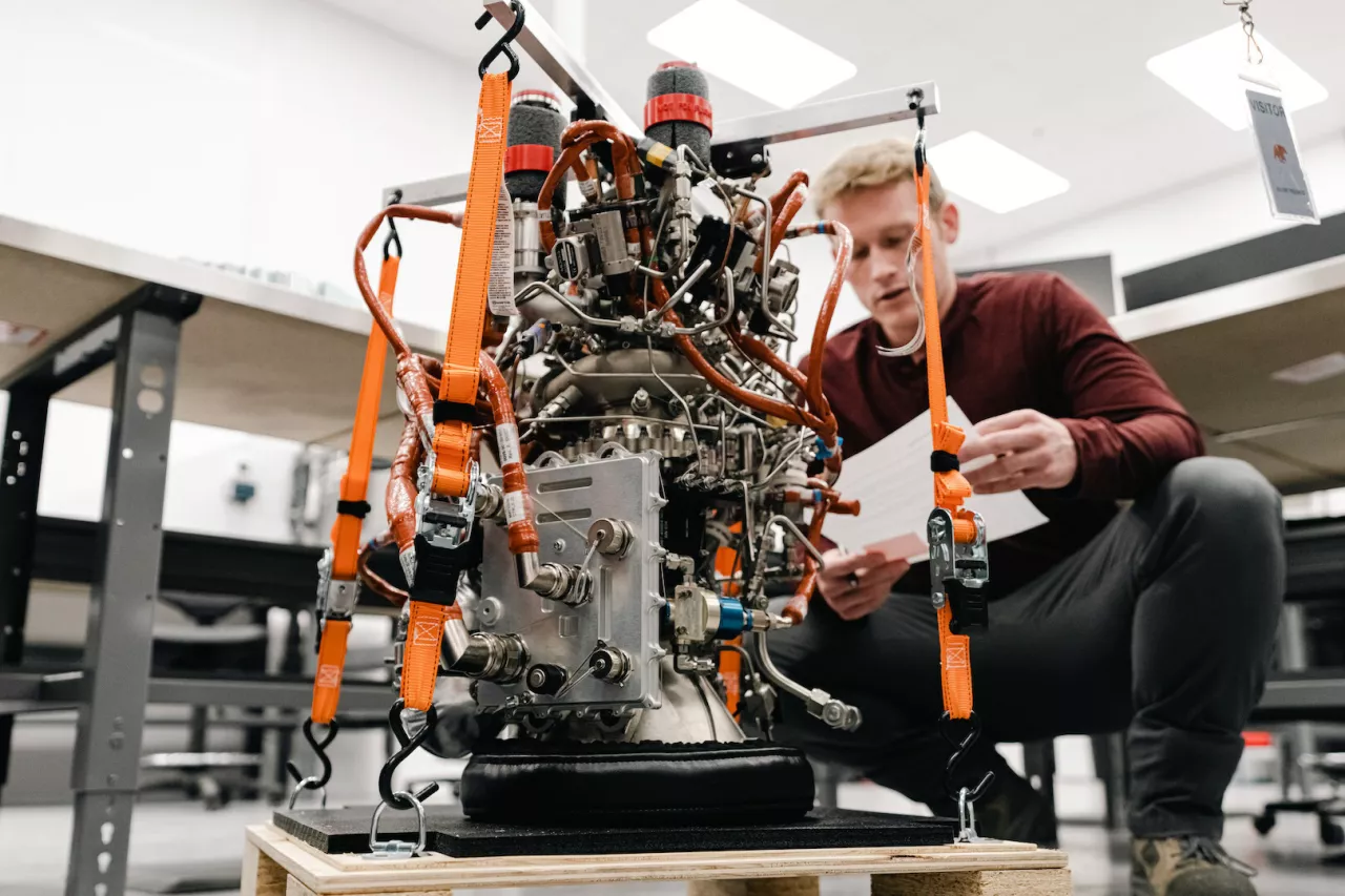 Jordan Forness, Vehicle Operations Manager at Ursa Major, reviews a Hadley engine before it ships to Astra img#1