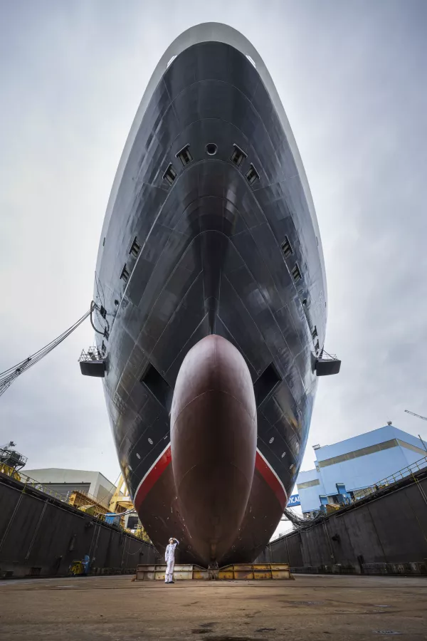 Safety Officer Lucas Wozniak inspects the hull of Queen Anne as the world’s most iconic luxury cruise brand Cunard celebrated a momentous construction milestone today with the float out of their fourth ship at the Fincantieri Marghera shipyard in Venice, Italy. (Cunard) img#5