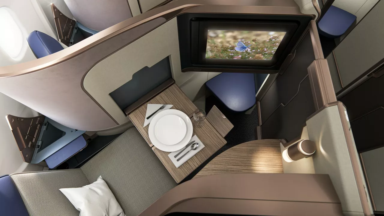 A premium lie flat business class suite, Aurora provides abundant seat width while optimizing privacy, with or without a door. img#3